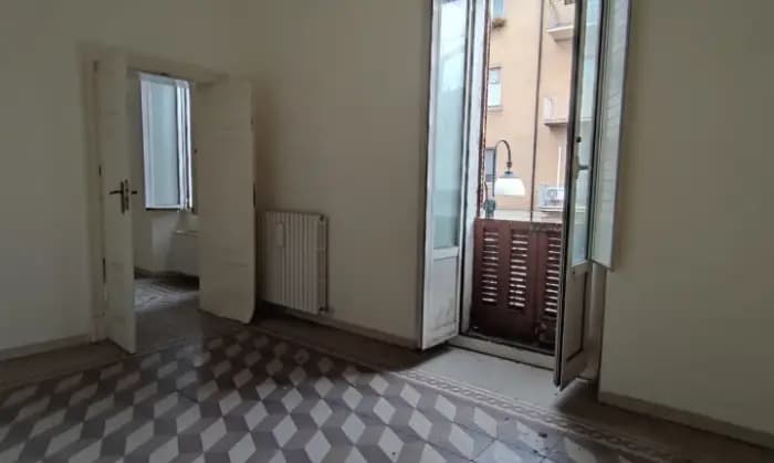 Rexer-Sulmona-Appartamento-con-due-camere-da-letto-camino-balcone-cantina-CameraDaLetto